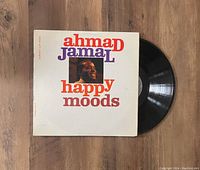 Photo of the album cover and partially visible vinyl record showing the front artwork and part of the record.