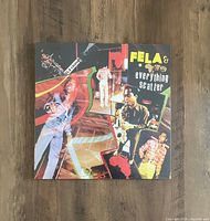 Cover of 'Everything Scatter' album by Fela Kuti & the Africa 70, sealed in original shrink wrap on wood surface
