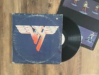 Photo showing Van Halen II vinyl record with original album cover and part of the inner sleeve/poster visible.