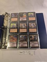 Close-up of a single protective page showing nine Visions set cards including creatures and artifacts