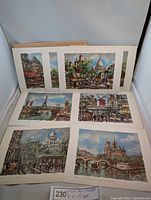 Eight colorful Krisarts lithographic prints of Paris landscapes showing landmarks like Moulin Rouge, Notre Dame, Eiffel Tower.