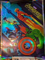 Full view of holographic foil Marvel Avengers poster showing Iron Man, Thor, Black Widow, Captain America, Hulk, and Hawkeye with bright reflective finish.