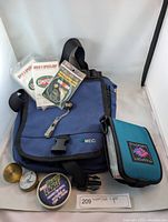 Full lot showing MEC bag with fishing accessories including fishing line, speed loops leaders, Fin Sport organizer pouch, and fishing line tension gauges.