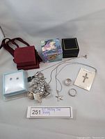 Full lot layout showing all jewelry items including bracelet, rings, pendant, and necklace