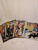 Full lot overview showing 11 comic books laid out in a fan shape