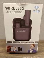 Front of box showing wireless microphone image and supported uses (recording, live broadcast, interview, online teaching, video) with 2.4G wireless symbol.