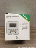 Box front showing BN-LINK digital timer with LCD and feature highlights.