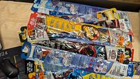 Photo of 35 new poly face kites with Star Wars and Spider-Man graphics still in packaging.