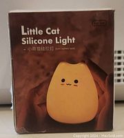 Photo of Little Cat Silicone Light LJC-124 box showing product image and branding details
