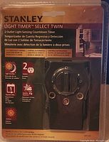 Packaging front showing product brand, name, key features such as 2 outlets, light sensing detection, weather resistant, countdown timer.