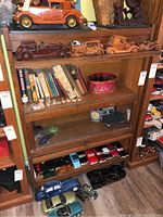 Front view of barrister bookcase with items inside.