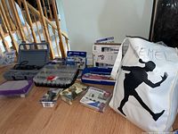 Full lot overview showing Dremel bag, carrying cases with bits, and boxed items