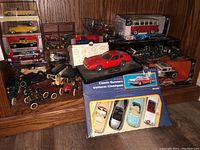 Wide shot of shelf showing display cases, boxed sets, loose models