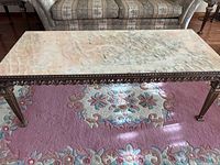 Full top and side view of the rectangular onyx marble surface of the coffee table, highlighting the natural marble veining and smooth finish.