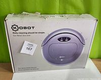 Original Kobot RV353 robot vacuum box in gunmetal color with some damage on top flap, front shows product image and model info.
