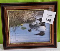 Full view of framed print showing spatial dimensions and depiction of loon with young on water, under glass in wood frame