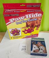 Box of Paw Hide Dog Toy Puzzle with dog image and branding.
