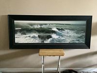 Front view of the large framed panoramic picture showing a Belle Isle seascape with waves and rocks.