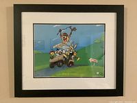 Front view of framed Looney Tunes lithograph with Bugs Bunny, Taz, and other characters on a golf cart.