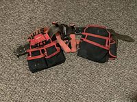 Photo showing Hilti tool belt laid flat to display multiple pockets and adjustable straps.