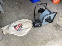 Full view of dust collector with attached collection bag