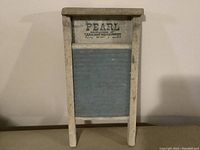 Full front view of the vintage washboard showing wooden frame and metal scrubbing surface.