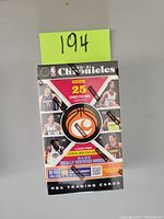Front view of the sealed 2020-21 Panini Chronicles NBA basketball trading card cereal box showing branding, player images, and card count information.