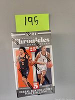 Front view of the sealed 2021 Panini Chronicles Draft Picks Basketball Cereal Box showing the players Cade Cunningham and Jalen Green.