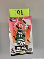 Front of sealed 20/21 Panini Mosaic Basketball trading cards cereal box showing Luka Dončić image and Panini branding.