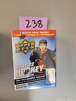 Photo of sealed 2021-22 Upper Deck Series One hockey card blaster box with Edmonton Oilers player on front.