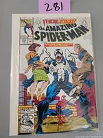 Front cover of The Amazing Spider-Man #374 comic showing Venom attacking Mary Jane and Richard Parker with Spider-Man in background, price $1.25 US, 50th anniversary edition.