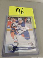 Front of Connor McDavid hockey card showing player image and Upper Deck logo