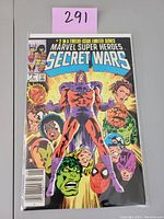 Front cover of Marvel Super-Heroes Secret Wars #2 newsstand comic book in protective sleeve, showing cover art and issue details.