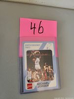 Front image of Michael Jordan basketball card showing him mid-jump in North Carolina Tar Heels uniform with card branding and logos.