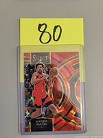 Front of Scottie Barnes basketball card with action photo, Select logo, and decorative background