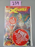 Front cover photo showing X-Force #1 comic book in protective polybag with promotional trading card label.