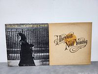 Cover of two Neil Young LP albums: Harvest and After the Gold Rush side by side on a white background.