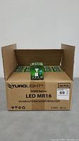 Full box of 50 Turolight Vivid Series LED MR16 light bulbs with one bulb box displayed on top.