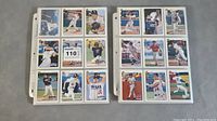 Full view of two binder pages with multiple baseball cards sleeved, mostly 1993 Upper Deck cards showing various players.
