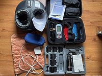Full lot contents including the Bioflex foot massager, heating pad, and Andis clipper with attachments
