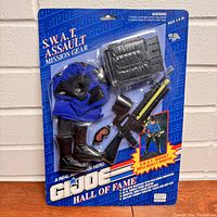 Full front view of the sealed GI Joe Hall of Fame S.W.A.T. Assault Mission Gear accessory pack on original card showing all included items and labeling.