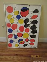 Framed Venusiennes lithograph by Alexander Calder showing full abstract composition and frame.