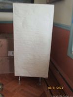 Full view of the soft light rectangular fabric shade floor lamp showing its height and shape.