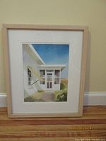 Framed watercolor painting showing the porch with sea oats under bright sky.