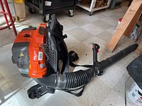 Full view of backpack blower with tube and harness