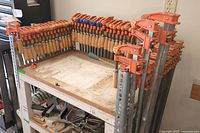 Front view showing clamps arranged along shelf edges.
