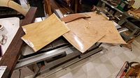 Veneer sheets on table saw: curly Anigre and maple burl veneers