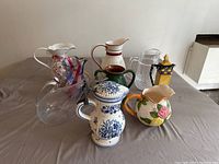 Overview of all 9 pitchers showing various sizes, colors, and styles.