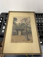 Front view of framed woodblock print on shelving