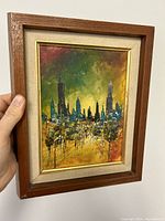 Front view of framed oil painting on board